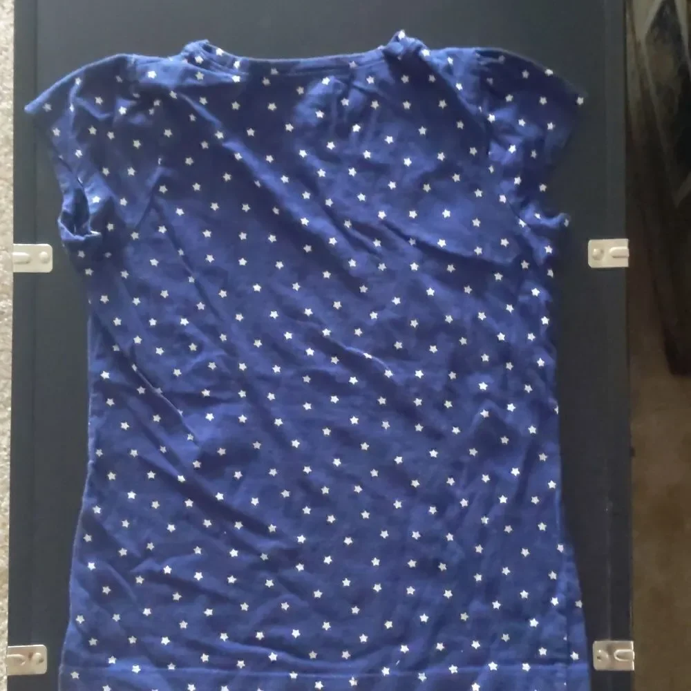 Girls blue tshirt with white stars size 8.
